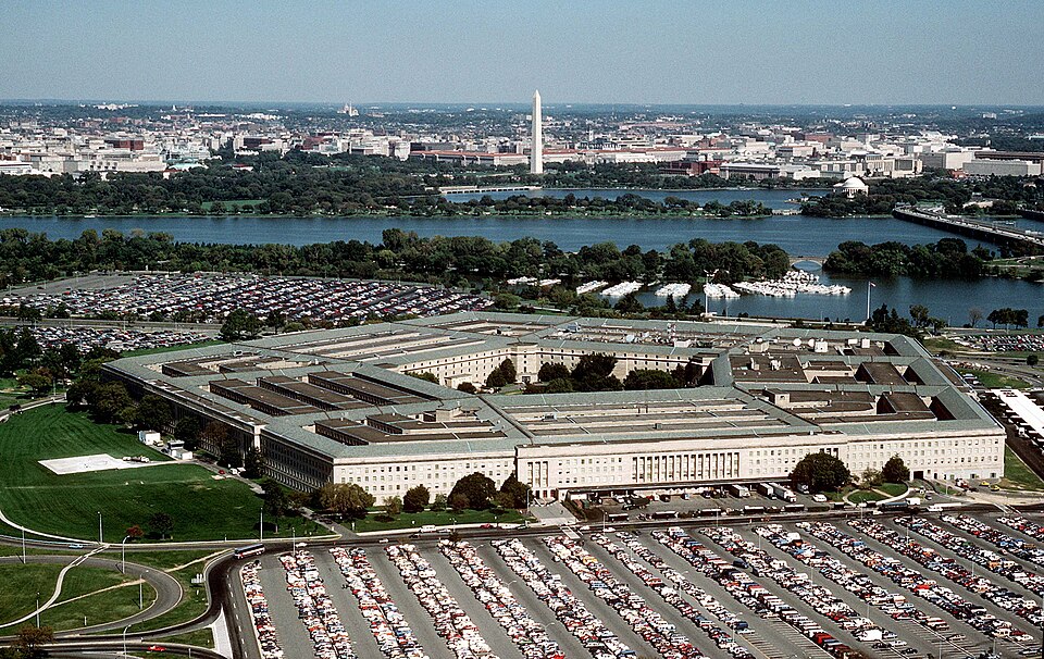 The Pentagon, looking northeast with the Potomac River and Washington Monument in the distance.
The Tidal Basin is seen just below the Washington Monument. The marina which is visible is in Pentagon Lagoon, which is part of the Boundary Channel of the Potomac River. Trees border the Boundary Channel