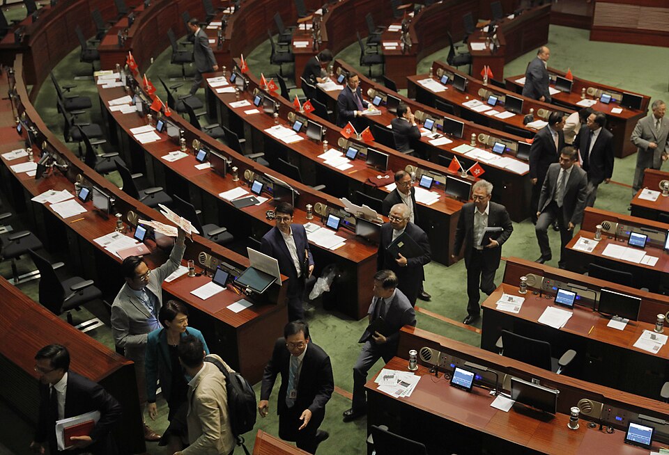 Hong Kong pro-China establishment lawmakers leaving the chamber to force adjournment.