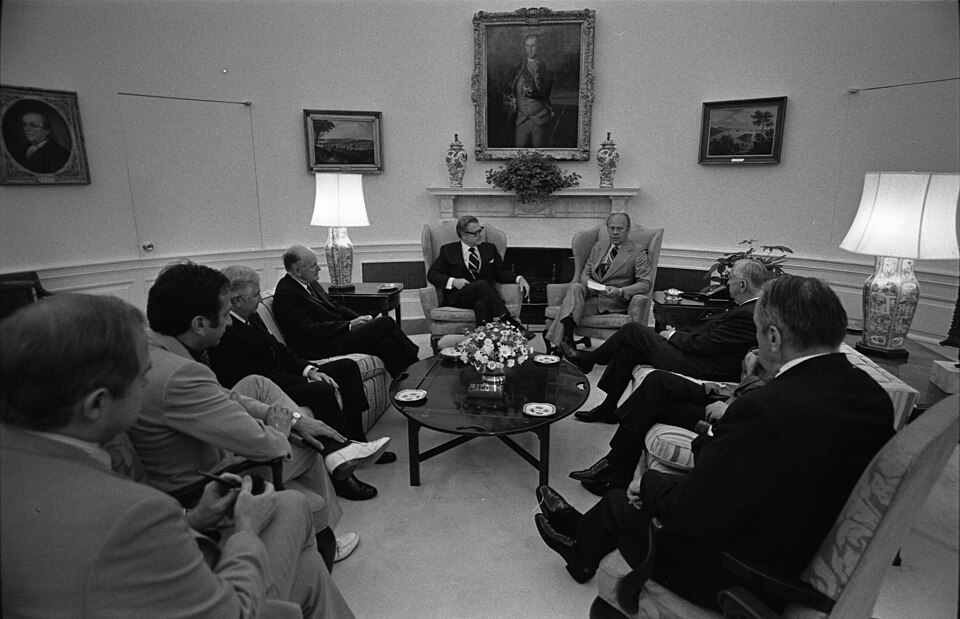 Scope and content:  This photograph depicts President Gerald R. Ford meeting with Vice President Nelson A. Rockefeller, Chairman of the Commission on  Central Intelligence Agency (CIA) Activities Within the U.S., and Commission members David Belin, John Connor, C. Douglas Dillon, Lane Kirkland, and 