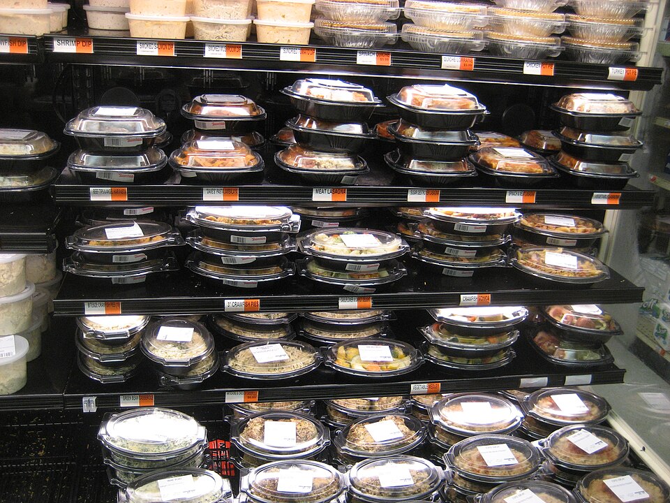 New Orleans: Display case of prepared meals in grocery store Uptown includes such regional favorites as crawfish pie, crawfish Monica, and jambalaya.