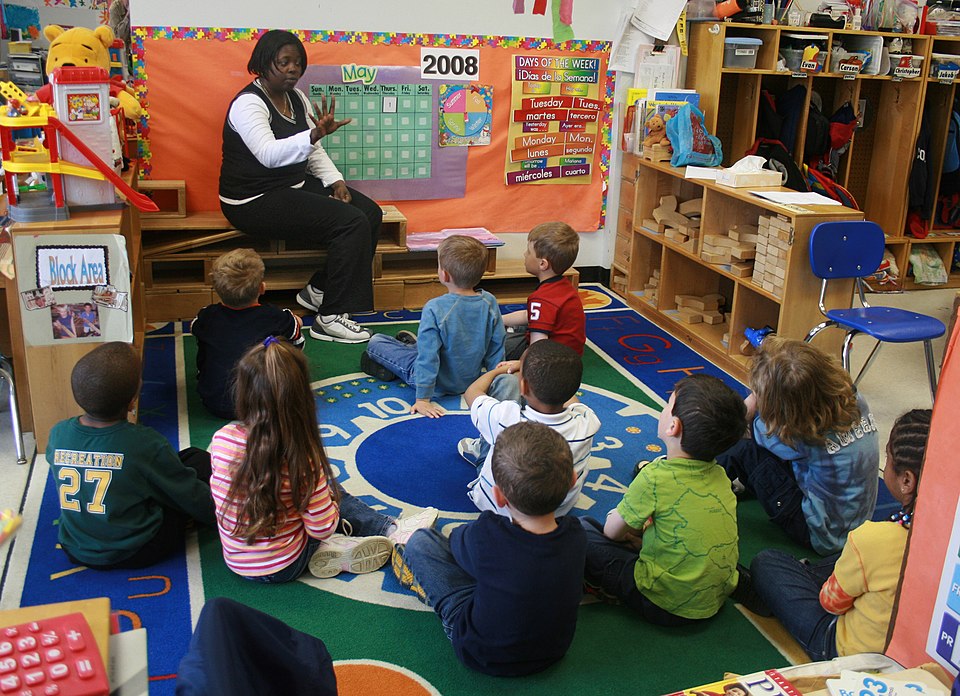 Teacher teaching students in an early childhood setting.