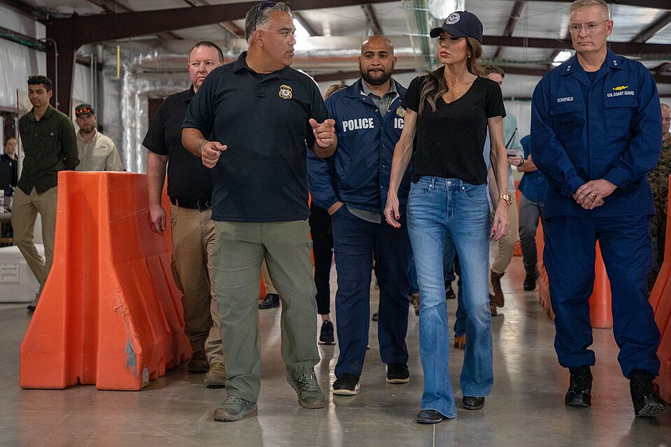 An interagency official briefs Department of Homeland Security (DHS) Secretary Kristi Noem on medical screening procedures during a visit to the migrant operations center Naval Station Guantanamo Bay, Cuba, Feb. 7, 2025. Joint Task Force Southern Guard the illegal aliens holding operations led by DH
