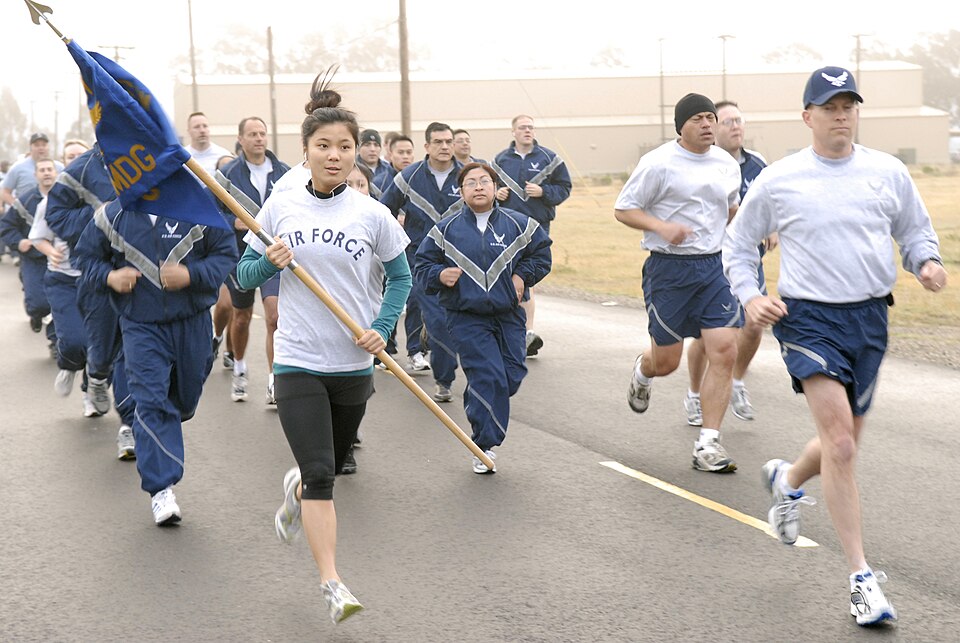U.S. Airmen with the 30th Medical Group run in formation during the Fit-to-Fight run at Vandenberg Air Force Base, Calif., April 3, 2008. During the run, several Airmen wore teal shirts to support sexual assault awareness.