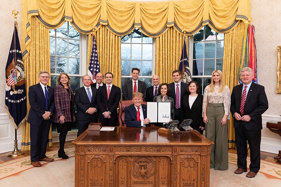 President Donald J. Trump, joined by Chris Liddell Assistant to the President and Deputy Chief of Staff for Policy Coordination, Adviser to the President Ivanka Trump and invited guests, as he display his signature after signing the Executive Order on “Maintaining American Leadership in Artificial I