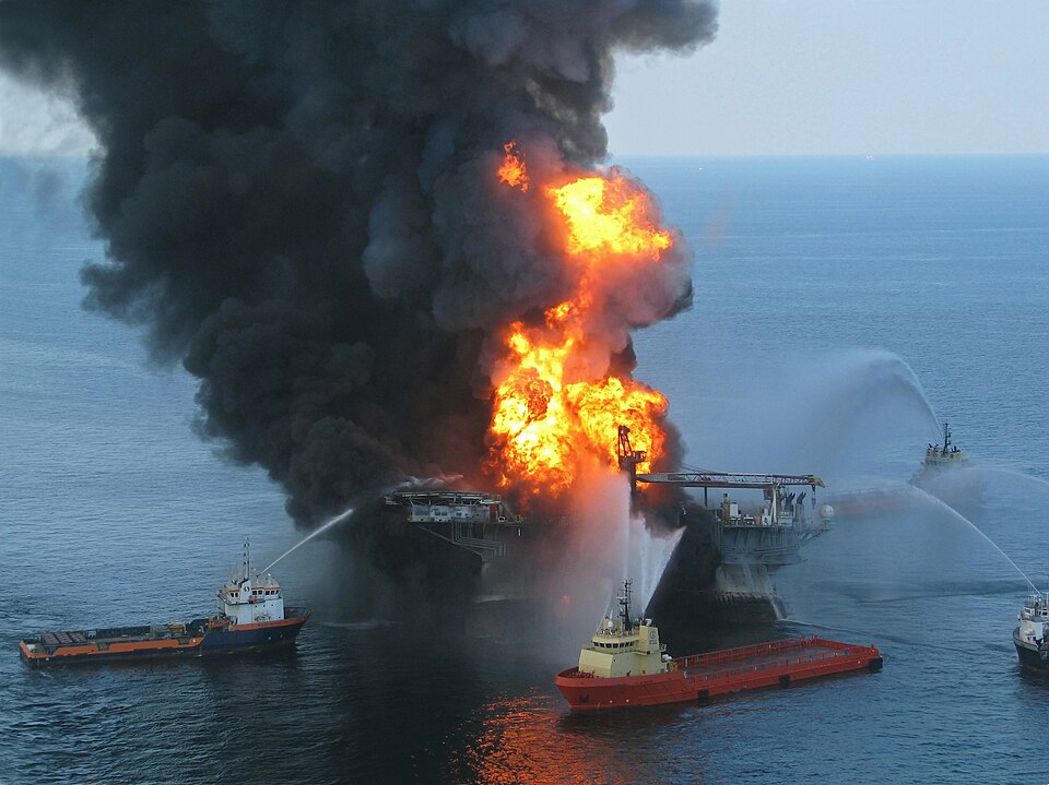 Platform supply vessels battle the blazing remnants of the off shore oil rig Deepwater Horizon. A Coast Guard MH-65C dolphin rescue helicopter and crew document the fire aboard the mobile offshore drilling unit Deepwater Horizon, while searching for survivors. Multiple Coast Guard helicopters, plane