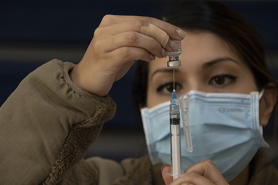 A Reserve Citizen Airman assigned to the 307th Medical Squadron prepares a syringe before administering a COVID-19 vaccination at Barksdale Air Force Base, Louisiana, Nov. 7, 2022. The unit was administering the shots as part of on-going mitiagion efforts. (U.S. Air Force photo by Senior Airman Cele