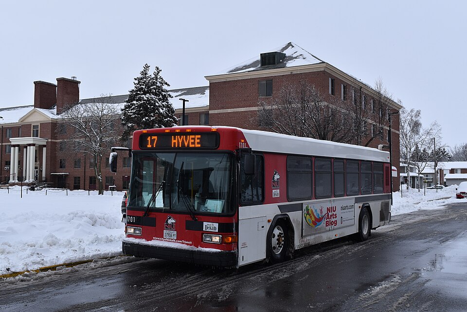Bus 1701 of DeKalb Public Transit serving Route 17 at the NIU Holmes Student Union in DeKalb, Illinois.