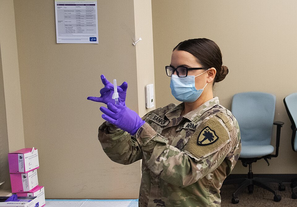 U.S. Army Pvt. 1st Class Mellanie Sanford, South Carolina National Guard Medical Command, prepares a syringe of the Pfizer COVID-19 vaccination, Oct. 16, 2021, for U.S. Army National Guard Soldiers with the South Carolina National Guard going through an Individual Medical Readiness Exercise (IMRX) a