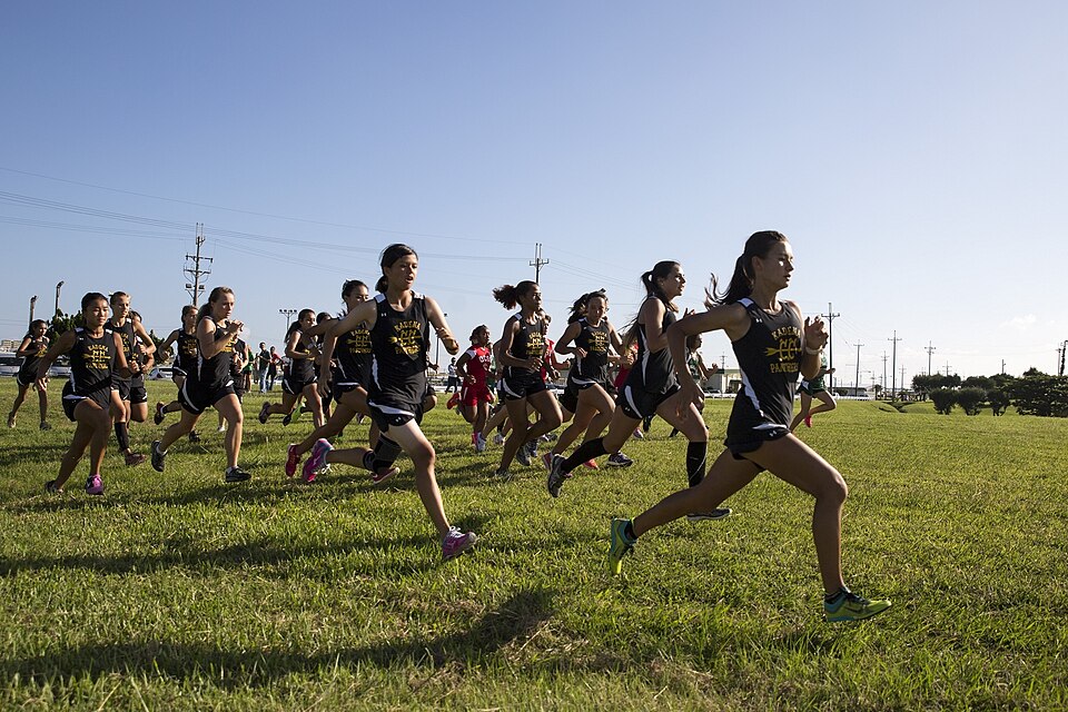 Okinawa high school student-athletes sprint to the front of the pack during a cross country meet Oct. 1 here. Department of Defense Education Activity Pacific schools, Kadena High School and Kubasaki High School, competed against local schools, Zion Christian Academy and Okinawa Christian School Int