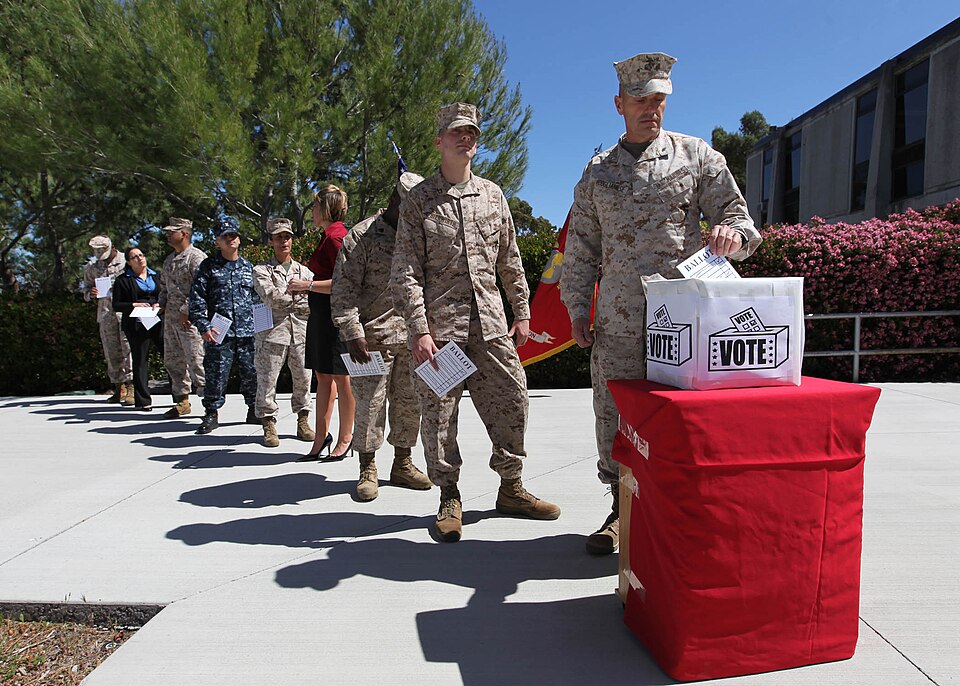 Brig. Gen. Vincent A. Coglianese, commanding general, Marine Corps Installations West, promotes voter registration with members of the Camp Pendleton's Installation Voting Assistance Office at Bldg. 1160 March 20. The base's IVAO first went into effect in 2011 in order to help provide service member