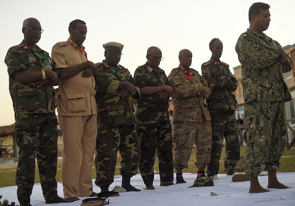 Photo 3 of 5: U.S. Navy Cmdr. Abuhena Saifulislam, U.S. Africa Command deputy command chaplain, leads the prayer at the Mogadishu International Airport, Mogadishu, Somalia, June 5, 2017. This was the first Iftar held between U.S. and Somali National Army military personnel. Additionally, it was the 