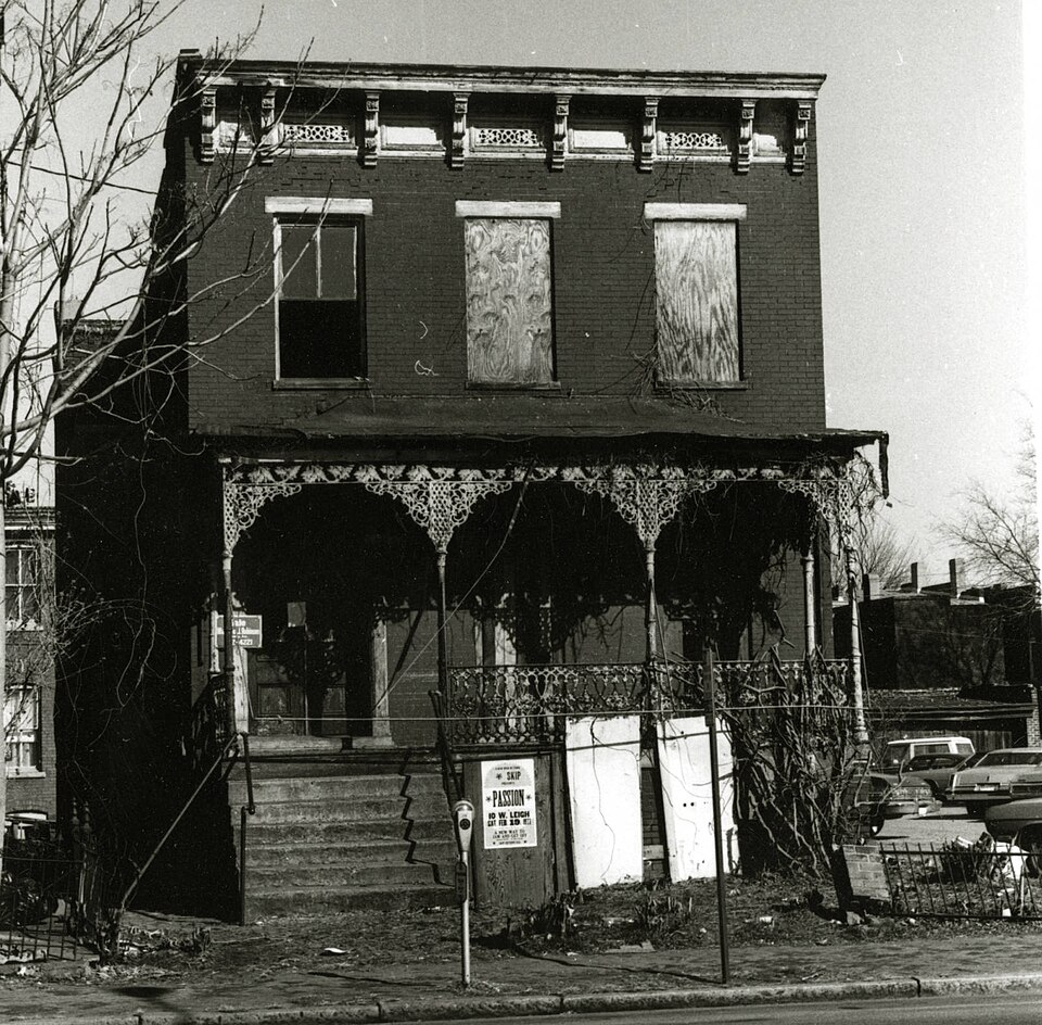 Address/Title: 20 West Marshall Street
Photographer: Zehmer, John G. (John Granderson), 1942-
Original Description (from Book): This abandoned house retains a very fine cast iron porch. Built on a high basement, the major architectural features are preserved in spite of the houses' [i.e. house's] il