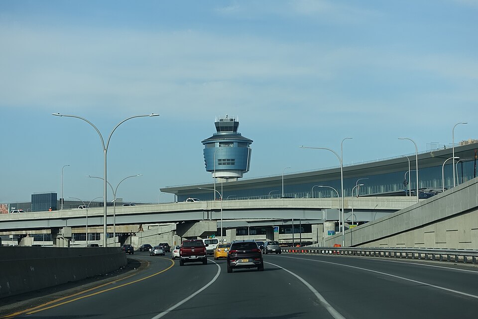 Traveling west on the Grand Central Parkway through LaGuardia Airport in East Elmhurst, Queens. Pictured is the air traffic control tower next to Terminal B (Central Terminal).