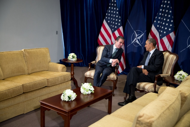President Barack Obama talks with NATO Secretary General Anders Fogh Rasmussen following their bilateral meeting in Brussels, Belgium, March 26, 2014.