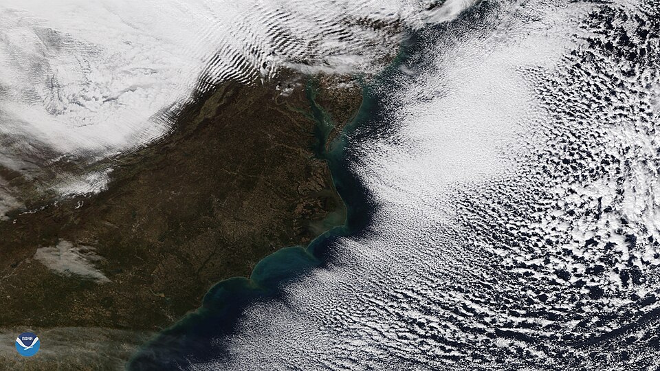 Wispy, parallel lines of clouds appeared off the coast of the Mid-Atlantic and Southeast U.S. in this image captured by the NOAA-20 satellite on Nov. 28, 2018. Known as "cloud streets," these parallel bands of cumulus clouds are often visible in satellite imagery during the colder months of the year