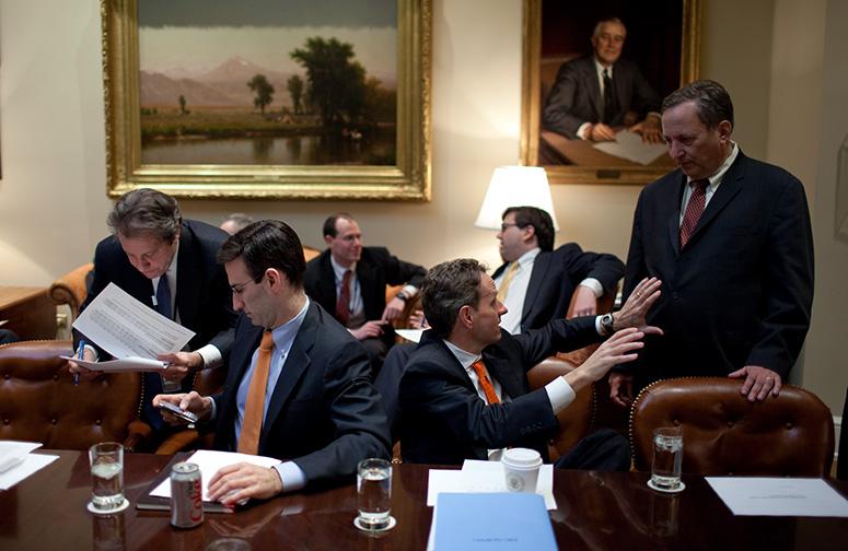 Key economic staff members confer during a budget session in the White House Roosevelt Room on Friday, Feb. 6, 2009. From left, Gene Sperling, advisor to the Secretary of the Treasury, confers with Office of Management and Budget director Peter Orszag and Treasury Secretary Tim Geithner talks with L