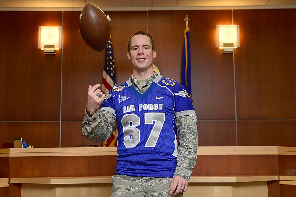 Capt. Tyler Weeks, 460th Space Wing Judge Advocate intern, wears his Air Force Academy Falcons jersey Aug. 12, 2015, on Buckley Air Force Base, Colo. Weeks played offensive line for the Falcons during his four years at the Academy. He is pursuing a law degree from the University of Colorado Law Scho