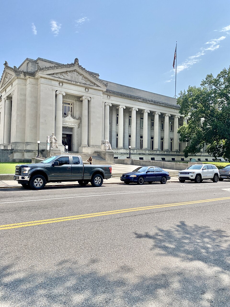 Built in 1906-1909, this Classical Revival-style building was designed by James Gamble Rogers and H. D. Hale of Hale and Rogers to serve as the Shelby County Courthouse.  The building features a limestone-clad exterior with two-story porticoes at the center of the front and rear facades with ionic c