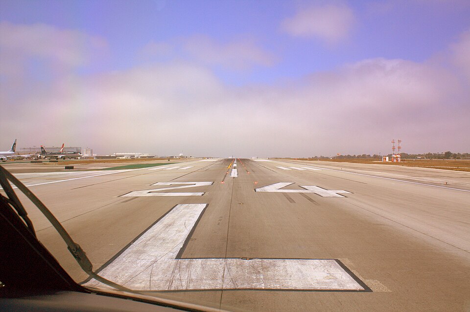 The FAA is currently studying the effectiveness of these stop lights on runways and taxiways at LAX as well as Dallas Ft Worth and San Diego. The Premise being that if you see red, don't go. As you can see from the photo, they seem to work pretty good. Once the red lights are extinguished, we still 
