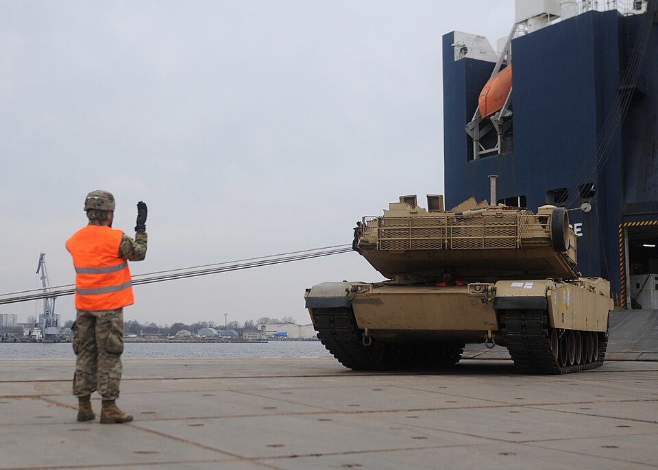 Soldiers from the 3rd Infantry Division offload an M1A2 Abrams Main Battle Tank from the transportation vessel “Liberty Promise” March 9 at the Riga Universal Terminal docks. More than 100 pieces of equipment, including the tanks, M2A3 Bradley Fighting Vehicles and assorted military cargo, will move