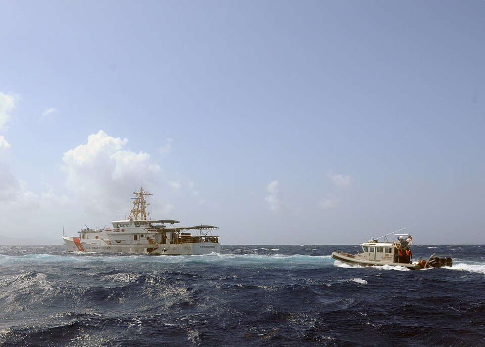 A St. Kitts Nevis Coast Guard 33-foot Special Purpose Craft – Law Enforcement boat closes in on the U.S. Coast Guard Cutter Kathleen Moore to embark a boarding crew at a culminating maritime event June 6 during Tradewinds 2015 Phase One. The Kathleen Moore role-played as a fishing vessel suspected o
