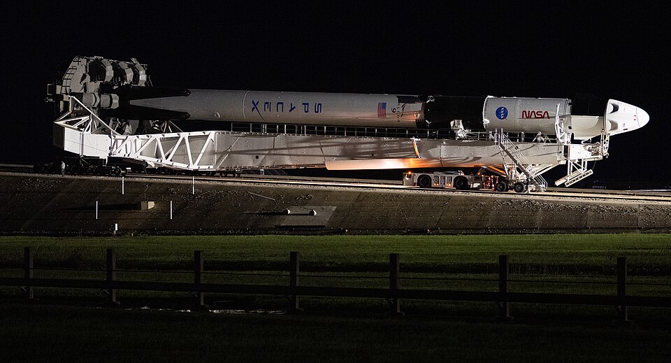 A SpaceX Falcon 9 rocket with the company's Crew Dragon spacecraft onboard is seen as it is rolled o