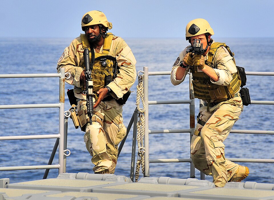 Members of a visit, board, search and seizure team from the littoral combat ship USS Freedom conduct tactical exercises aboard the guided-missile cruiser USS Bunker Hill. Freedom and Bunker Hill are supporting Southern Seas 2010, a U.S. Southern Command-directed operation that provides U.S. and inte