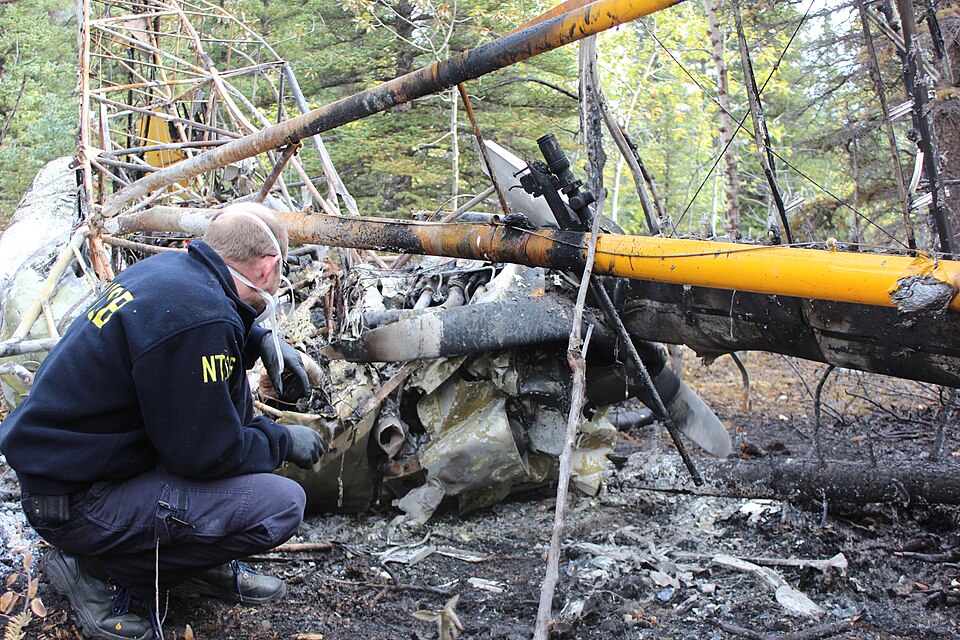 Air Safety Investigator Brice Banning assesses the scene of a Piper PA-18 Super Cub crash near McGrath, Alaska.