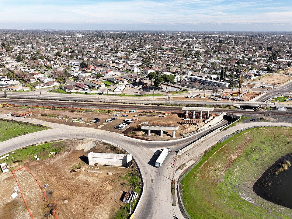 Construction site of the Belmont Avenue Grade Separation in Fresno, California. This structure will lead car traffic over current freight rail lines and the future California High-Speed Rail alignment. Photo from January 26th 2024. Bridge support columns and caps have been erected on the southwester