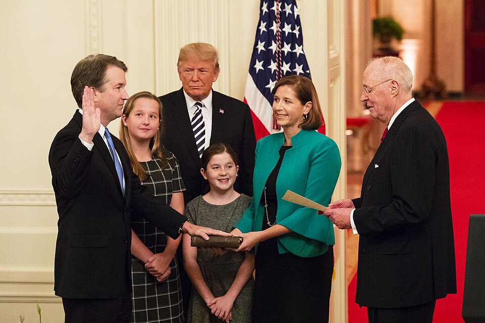 President Donald J. Trump looks on as Anthony M. Kennedy, retired Associate Justice of the Supreme Court of the United States, swears in Judge Brett M. Kavanaugh to be the Supreme Court's 114th justice Monday, Oct. 8, 2018, in the East Room of the White House in Washington, D.C. Justice Kavanaugh is