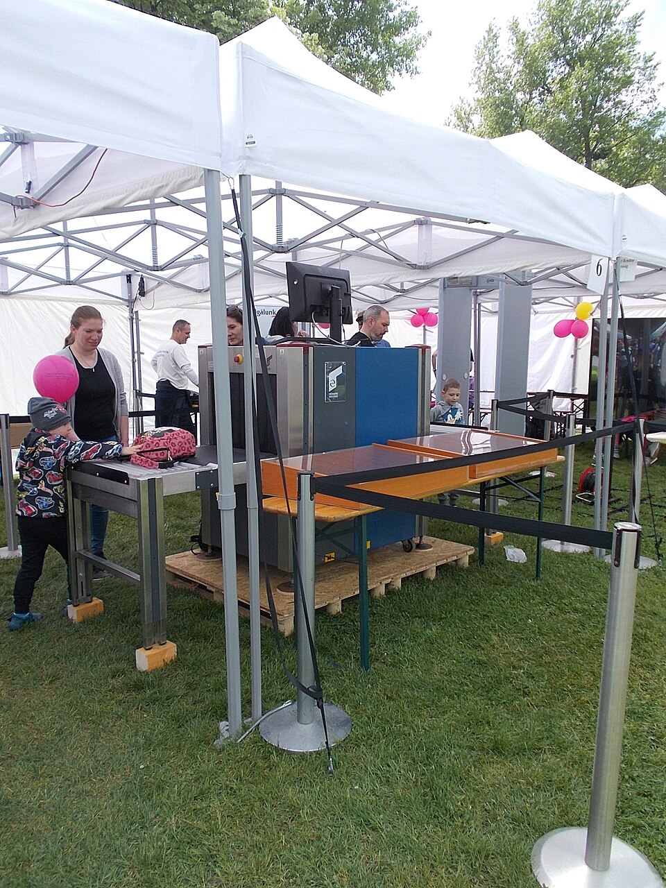 National Police Department (ORFK) Airport Police Directorate exhibition stand/tent, baggage screening X-ray Airport Security X-rays- Photo taken on the 11th National Police and Firefighter/Firefighting? Day in Budapest. - Police exhibition area in City Park neighborhood, Zugló district of Budapest.