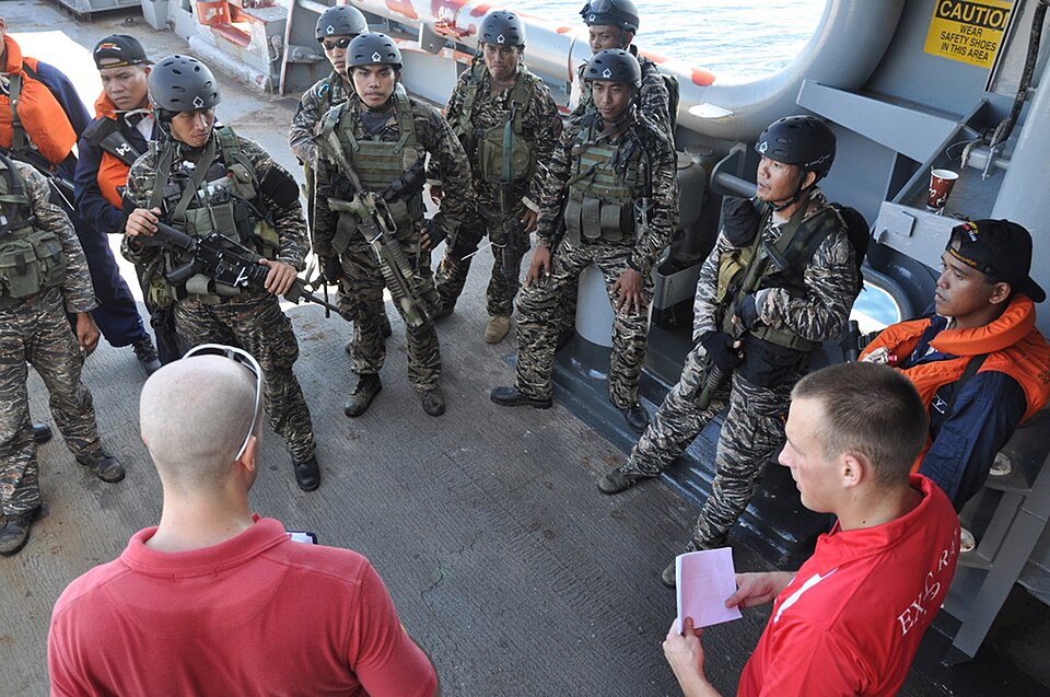 SOUTH CHINA SEA (Aug. 19, 2009) Members of a U.S. Coast Guard Maritime Safety and Security Team brief Philippine Navy Special Forces Sailors aboard Military Sealift Command rescue and salvage ship USNS Safeguard (T-ARS 50) following an at-sea boarding exercise for Southeast Asia Cooperation Against 