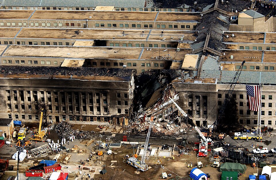 Aerial view of the Pentagon Building located in Arlington, Virginia showing emergency crews responding to the destruction caused when a hijacked commercial jetliner crashed into the southwest corner of the building, during the 9/11 terrorists attacks.