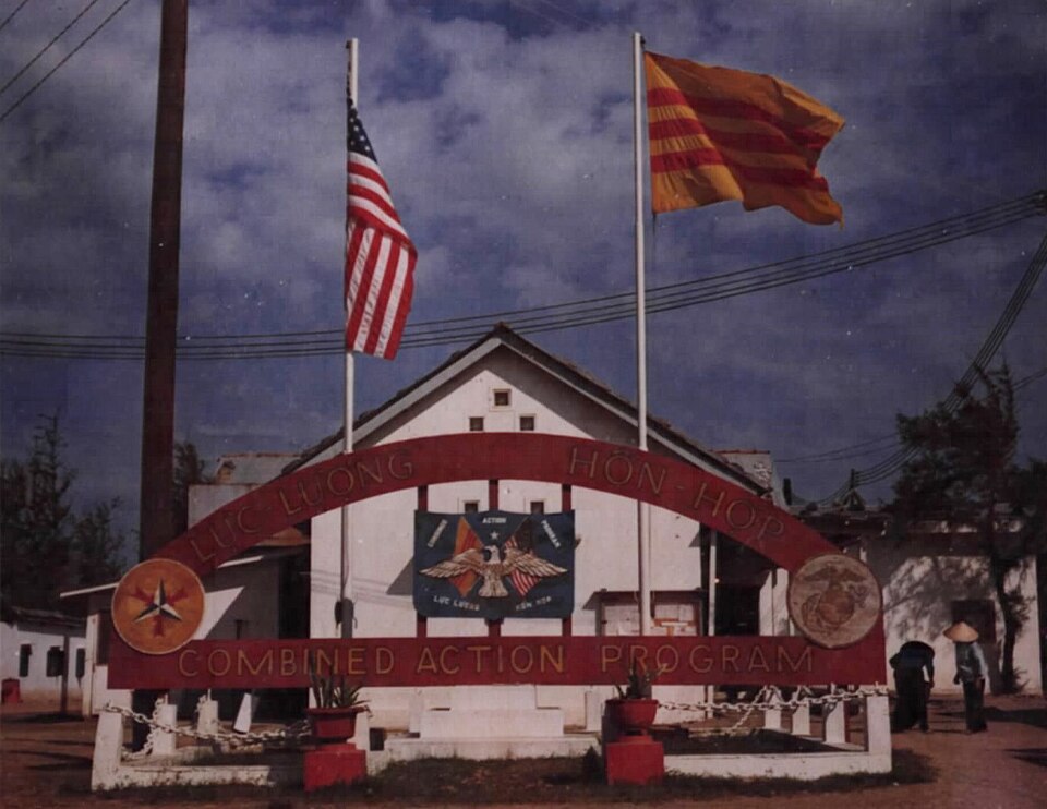 American and Vietnamese flags fly outside the Combined Action Program building at Danang. [Sign reads: Luc Luong Hon Hop Combined Action Program].
NARA 111-CCV-445-CC64488