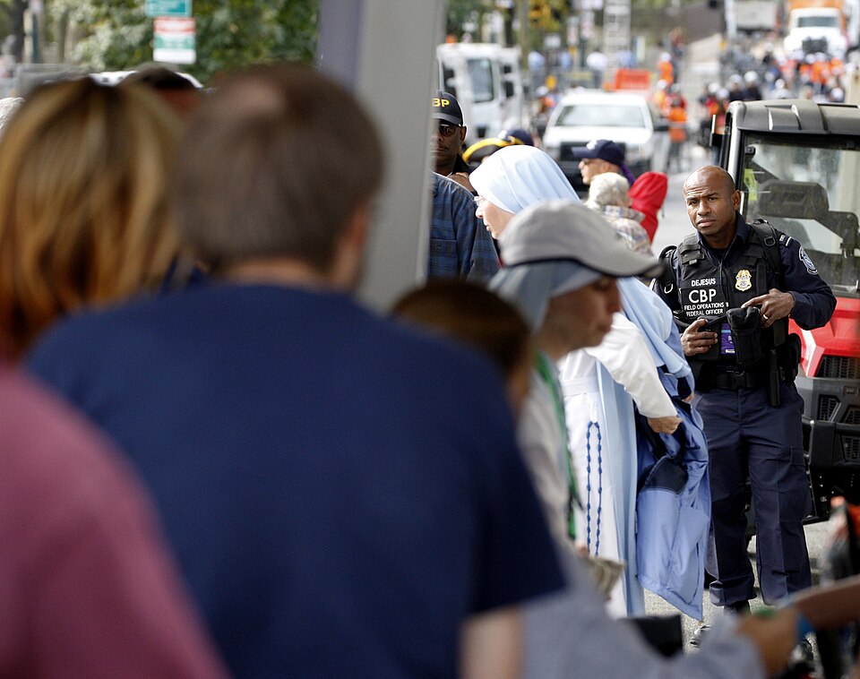 U.S. Customs and Border Protection (CBP) Officer Julio DeJesus (right) provides a law enforcement presence at a security checkpoint before Pope Francis' mass in Philadelphia September 27, 2015. CBP contributed to Papal security in Washington, D.C., New York City and Philadelphia during the Pope's we