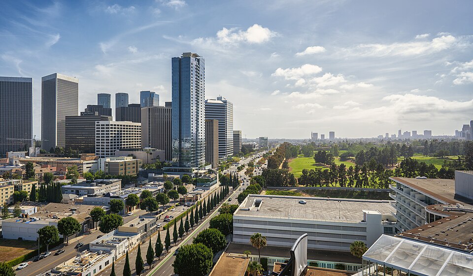Roof top View of Century City architecture from the Waldorf Astoria Hotel with the Beverly Hilton in the foreground. The Los Angeles Country Club Golf Course can be seen on the right.