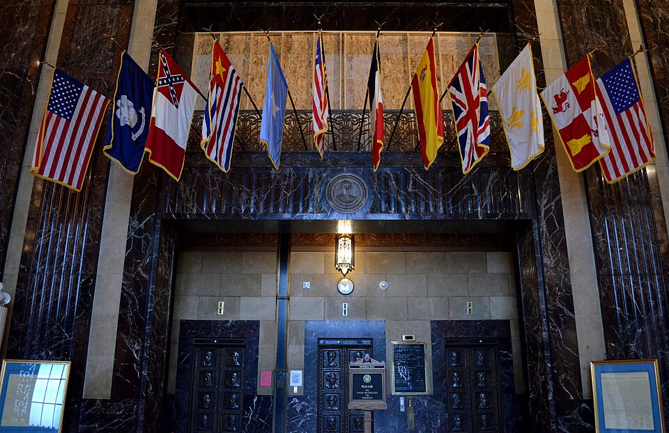 Flags in Memorial Hall at the Louisiana State Capitol in Baton Rouge, Louisiana symbolizing the entities that have governed Louisiana. From left to right: United States, State of Louisiana, Confederate States of America, Republic of Louisiana, Republic of West Florida, France, Spain, Great Britain, 