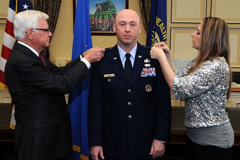 Lt. Col. Danny Davis, Air Force District of Washington A1 deputy director, pins on the rank of Colonel with the assistance of his wife Amy and U.S Congressman Hal Rogers, Kentucky’s 5th Congressional District, during his promotion ceremony at the U.S. Capitol Building, Washington D.C., January 7, 20