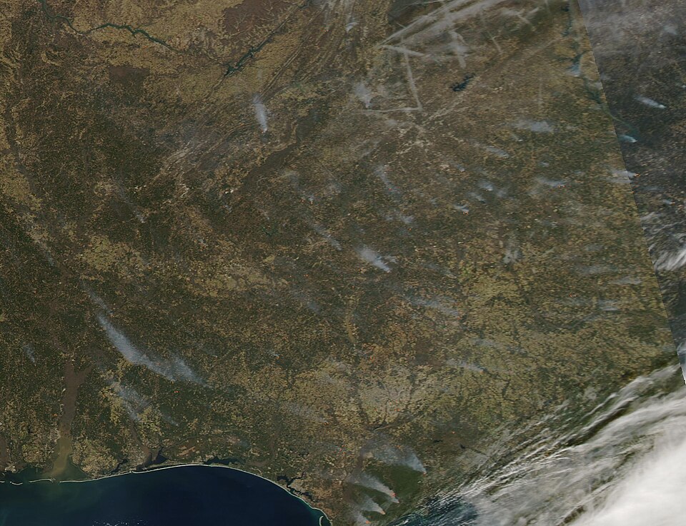 Dozens of fires were scattered over the Southeastern United States on February 15, 2022, when the Moderate Resolution Imaging Spectroradiometer (MODIS) on board NASA’s Aqua satellite acquired a true-color image of the region. Each red “hot spot” marks an area where the thermal sensors on the MODIS i