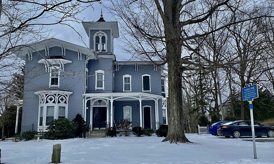 The Albion W. Tourgée House, 96 South Erie Street, Mayville, New York, January 2022. An absolutely magnificent Italian Villa-style mansion erected in 1881, the Tourgée House's design incorporates superlative examples of most of the style's defining features: a three-story central tower with double-w