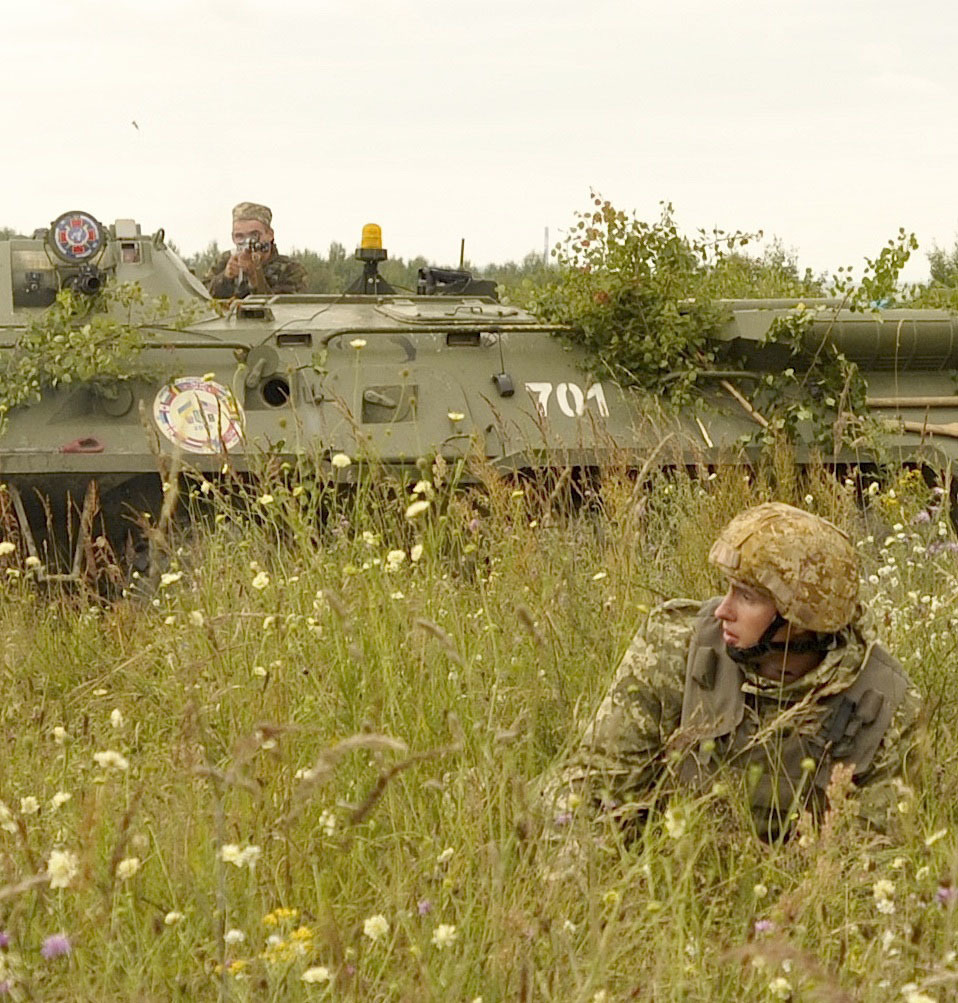 Ukrainian Marines fire from a BTR-80 armored personnel carrier at a checkpoint as part of the multi-national exercise Rapid Trident 2015 at the International Peacekeeping and Security Center in Yavoriv, Ukraine, July 29, 2015. Rapid Trident is a long-standing U.S. Army Europe-led cooperative trainin