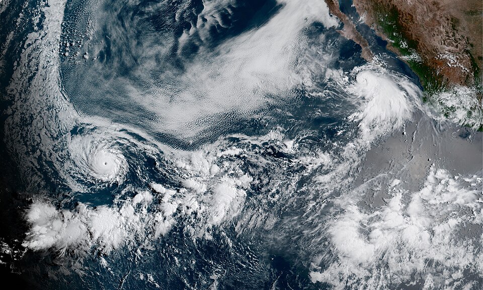Two simultaneous active tropical cyclones in the Pacific Ocean on August 6, 2023, Hurricane Dora (left) and Tropical Storm Eugene (right).