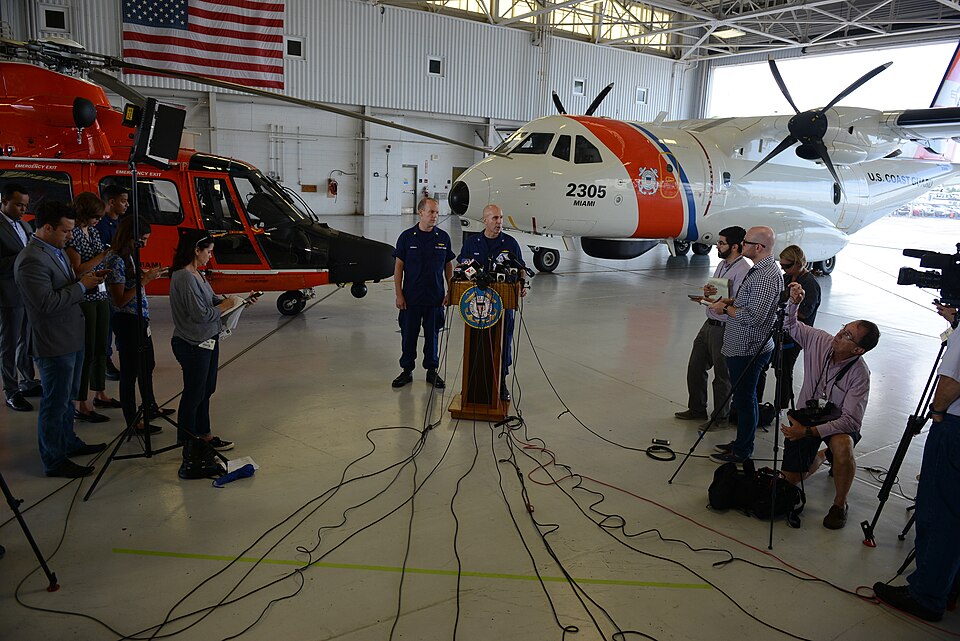 Coast Guard Capt. Mark Fedor responds to questions during a press conference for search-and-rescue operations for a missing container ship, El Faro, at Coast Guard Air Station Miami, Oct. 5, 2015. Thirty-three people were aboard the El Faro before it went missing in the Caribbean Sea. (U.S. Coast Gu