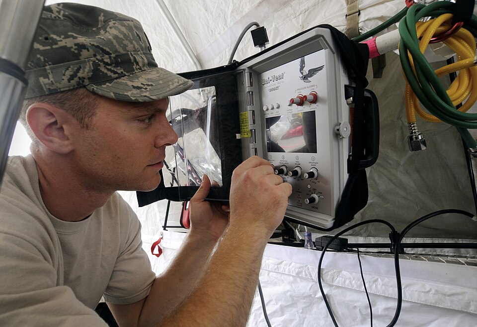Oregon Air National Guard 2nd Lt. Joel Larson inspects medical equipment during the Oregon National Guard's CBRNE Enhanced Response Force Package (CERFP) Search &amp; Extraction Team and train with personnel from Tualatin Valley Fire and Rescue during the CERFP's training exercise at the Tualatin Va