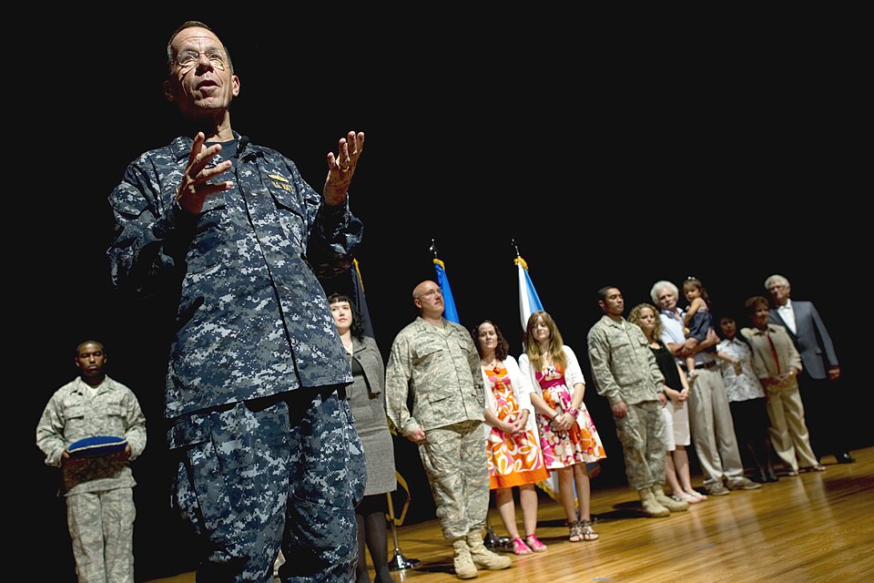U.S. Navy Adm. Mike Mullen, chairman of the Joint Chiefs of Staff, addresses audience members at an awards ceremony recognizing three airmen with the Bronze Star award for their tours of duty in Afghanistan during an all-hands call on Charleston Air Force Base, S.C., June 3, 2010. DoD photo by U.S. 