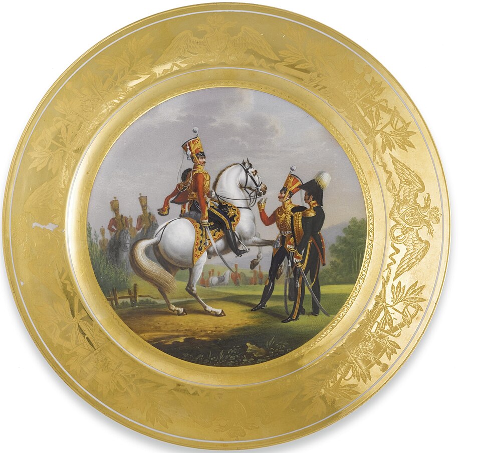 A Russian Porcelain Plate from a Military Service, Imperial Porcelain Manufactory, St. Petersburg, Period of Nicholas I (1825-1855), dated 1829
the reverse titled Officier Supérieur et Subalterne du Régt. des Hussards de la Garde, 
dated 1829, and signed by the painter V. Semenov; also with blue Imp
