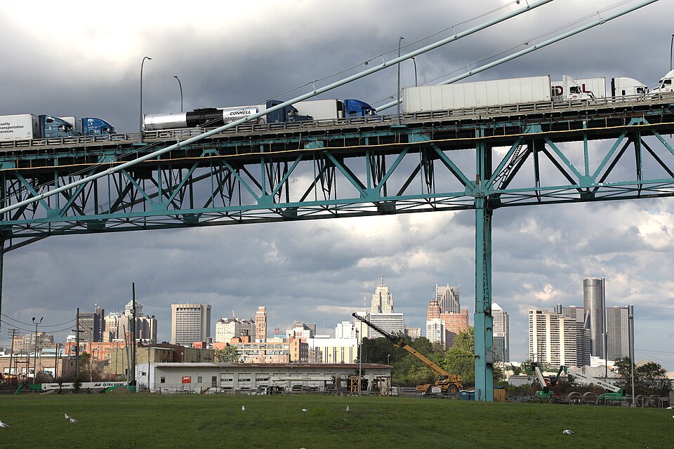 Ambassador Bridge truck cargo traffic and Detroit skyline in the background. The Ambassador Bridge c