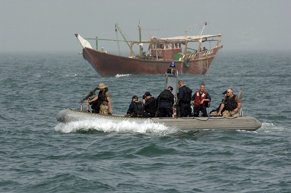 North Persian Gulf (June 13, 2005) - With a dhow in the background, Sailors assigned to coastal patrol craft USS Chinook (PC 9) make their way through the waters surrounding the Iraqi oil terminals in support of Maritime Security Operations (MSO). MSO sets the condition for security and stability in