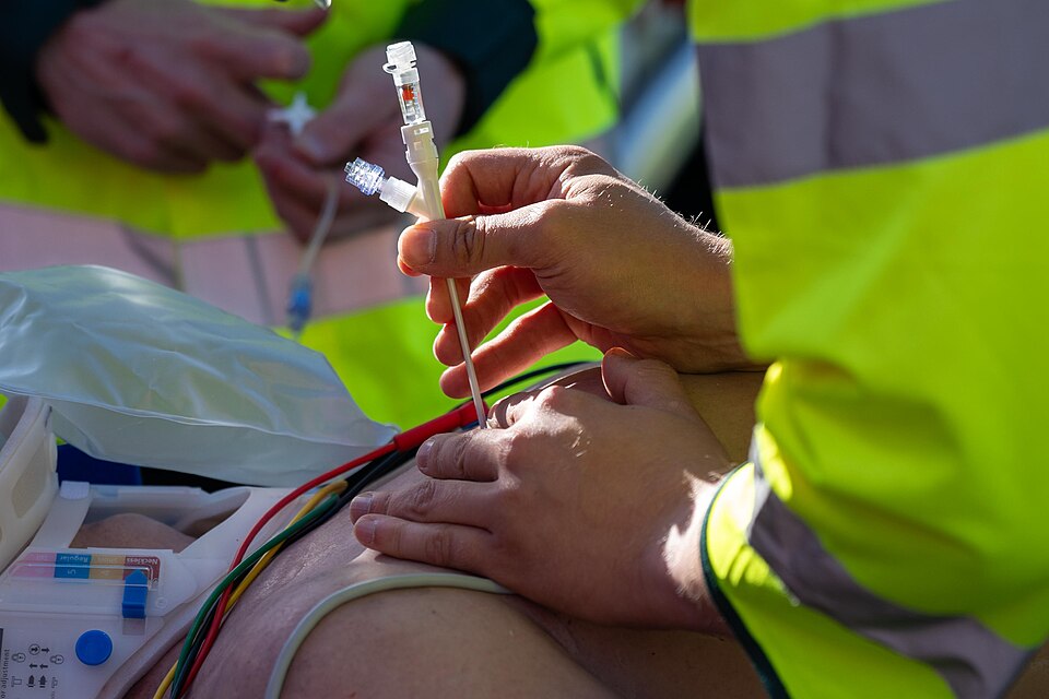 A UK paramedic performs a simulated medical procedure during a joint training exercise with Firefighters assigned to the 423rd Civil Engineer Squadron, Fire &amp; Emergency Services Flight at RAF Alconbury, England, Aug. 28, 2025. The training improved coordination during complex emergencies. (U.S. 