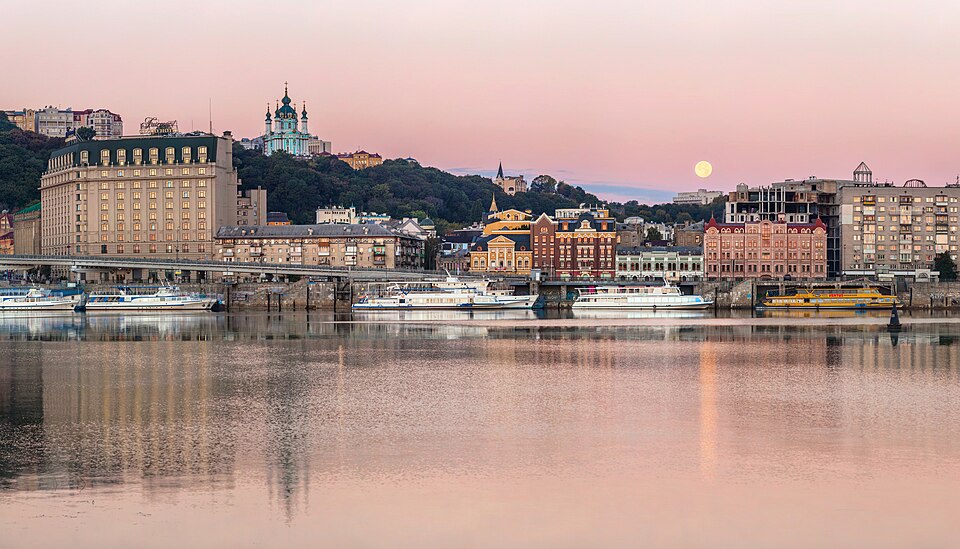 A view of Podil in Kyiv, in a center is a river port in front of the Fairmont Grand Hotel. St. Andrew's Church can be seen on the left.